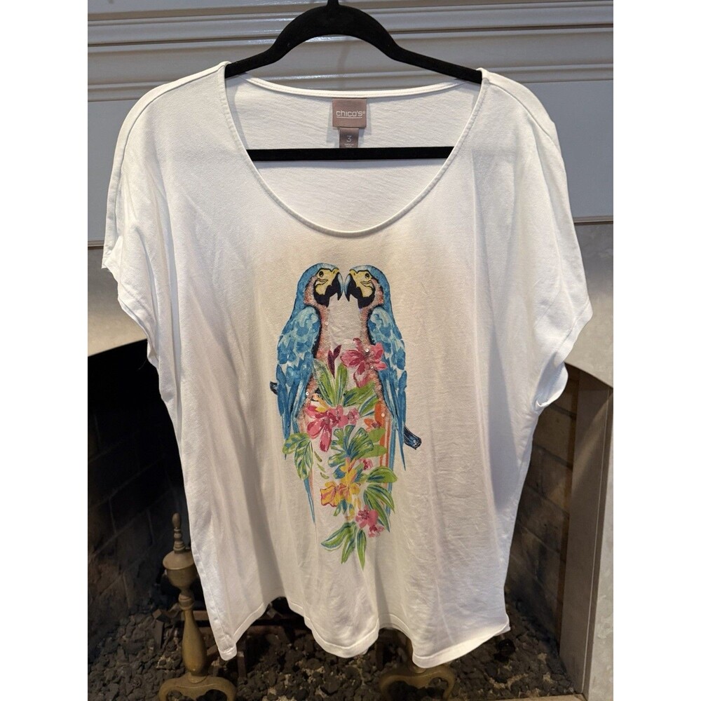 Chico’s Tee With Two Blue And Yellow Macaws Size XL or Chico’s Size 3. Torn
